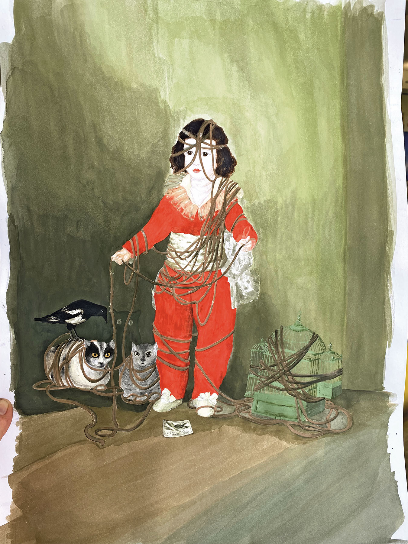 Bild Kind eingewickelt in Seilen neben zwei Katzen